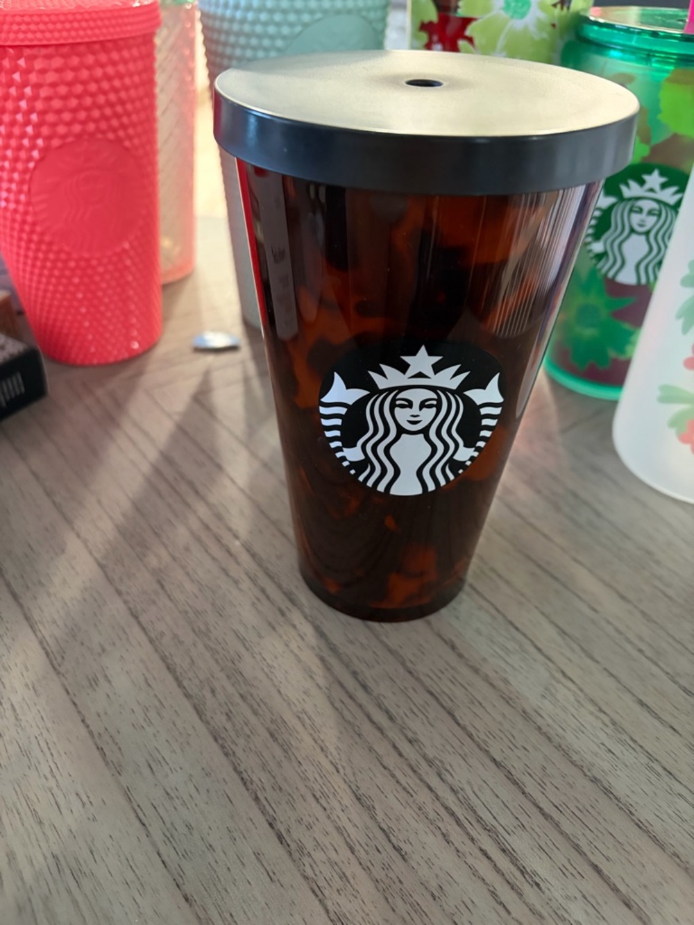 Starbucks Tortoiseshell Cold Cup with Black Lid and White Logo . No straw